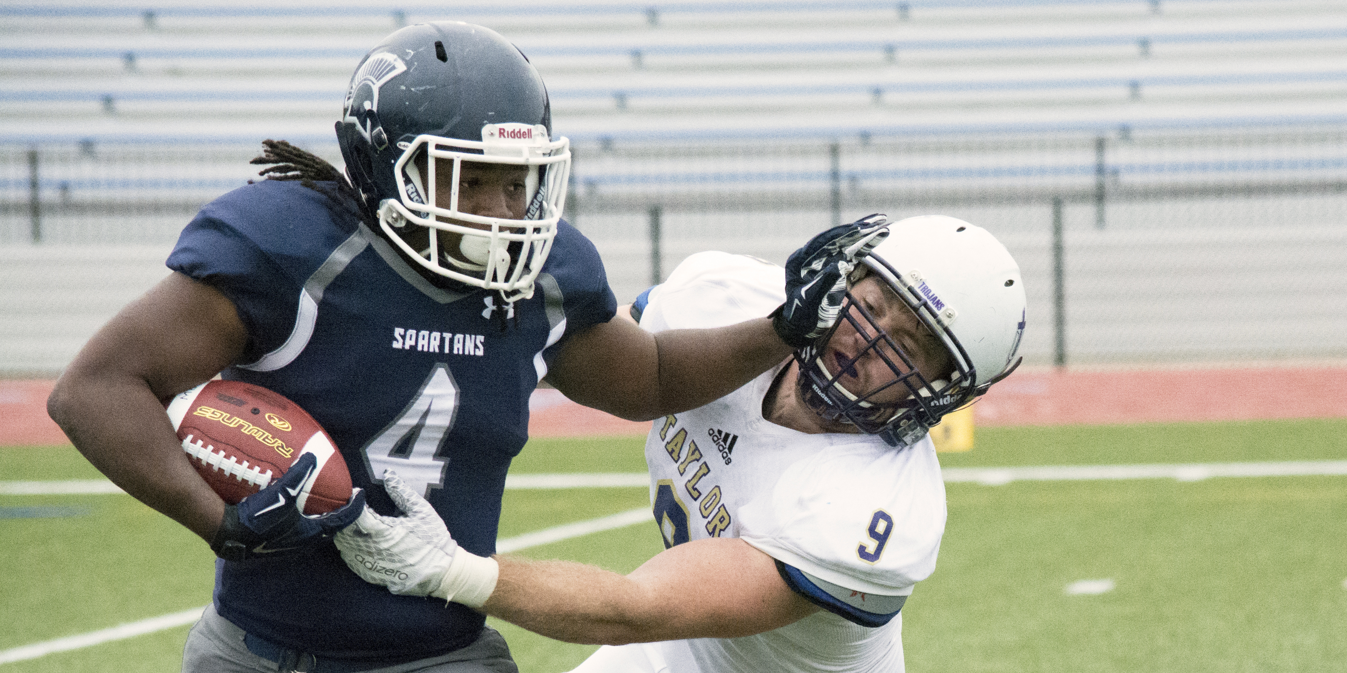 Antoryio Barton stiff-arms the Taylor defender. 