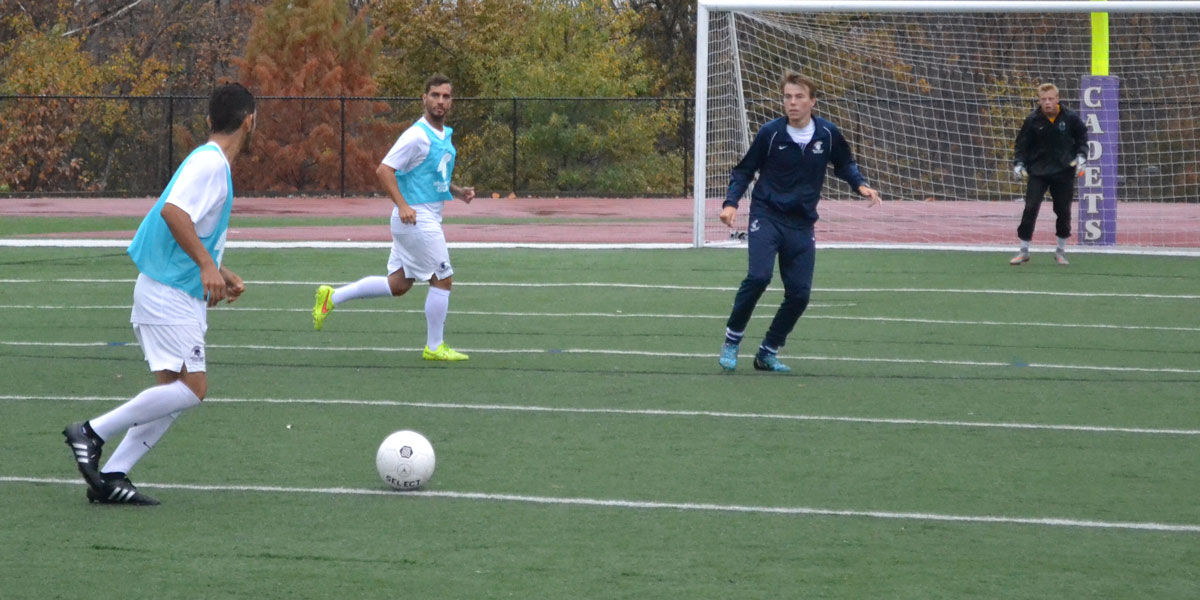 Gerardo Espinoza looking for a teammate to pass the ball to.